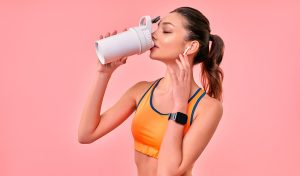 A young female having a protein rich nutrition drink post work out